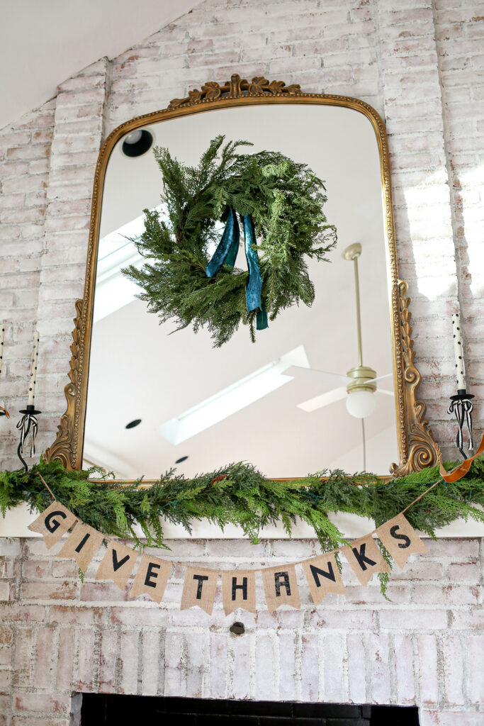 anthropologie primrose mirror decorated for the holidays