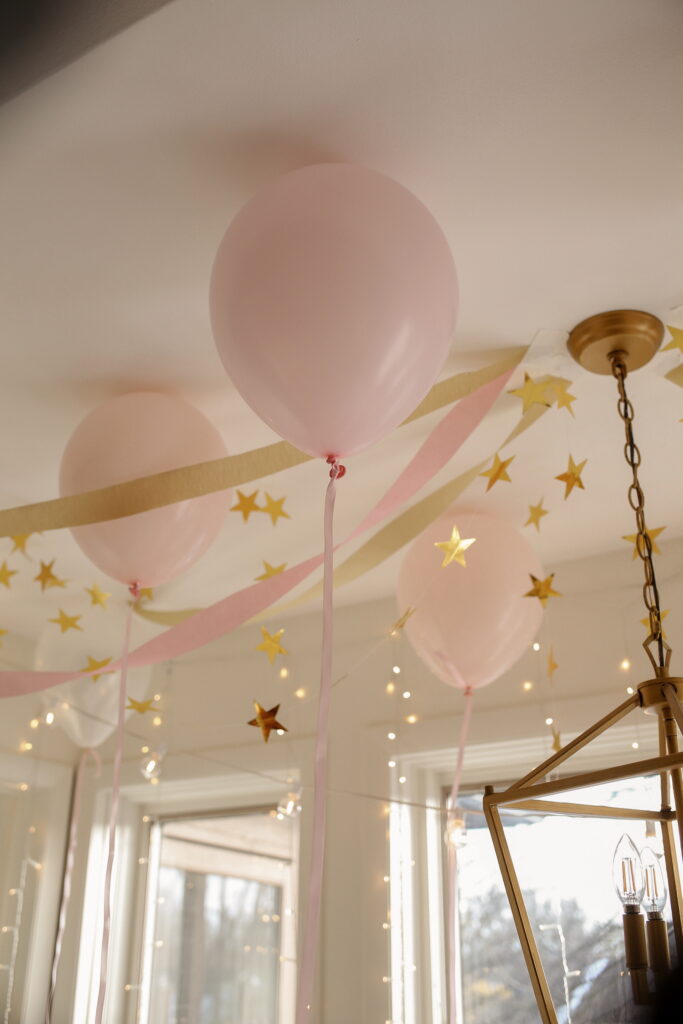 pink and gold balloons and streamers