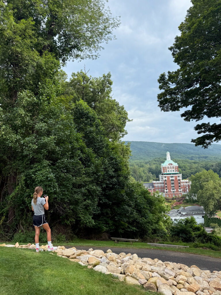Family hiking overlooking the Omni Homestead Resort in Virginia